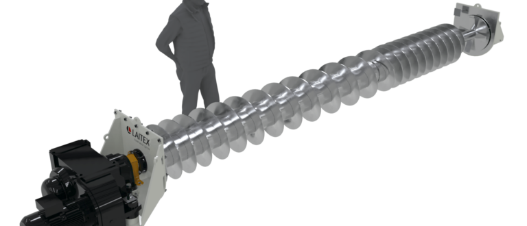 A man standing besides fuel feeding screw.