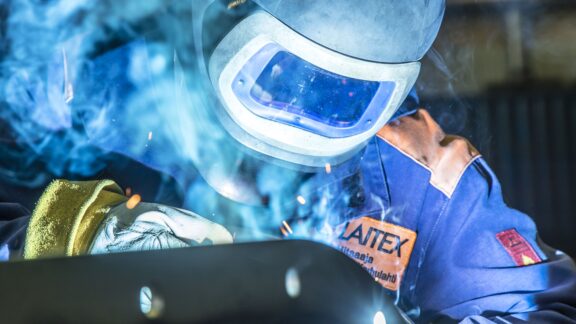 Welder welding a conveyor.