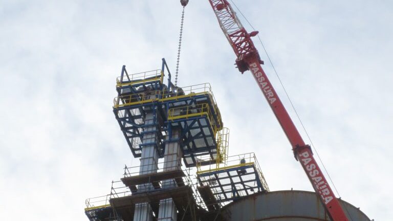 Bucket elevators lifted on top of the silo.