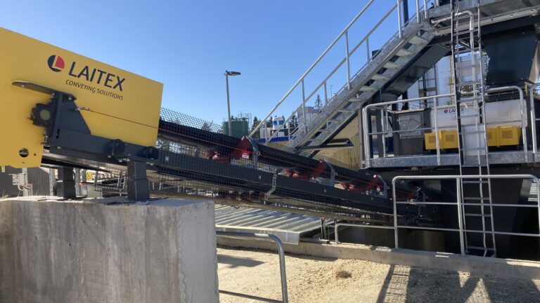 Blue sky and yellow conveyor system.